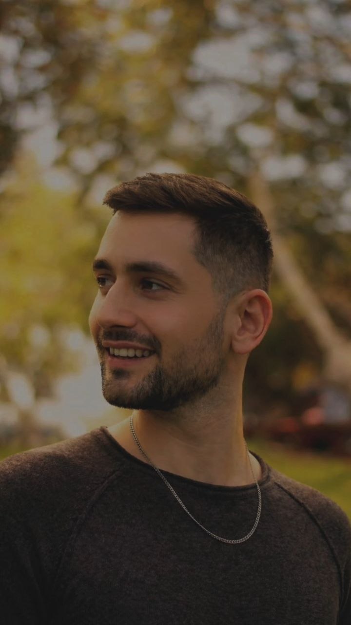 Orel Bitan smiling outdoors